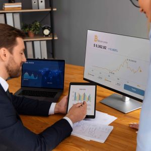person-looking-finance-graphs-scaled